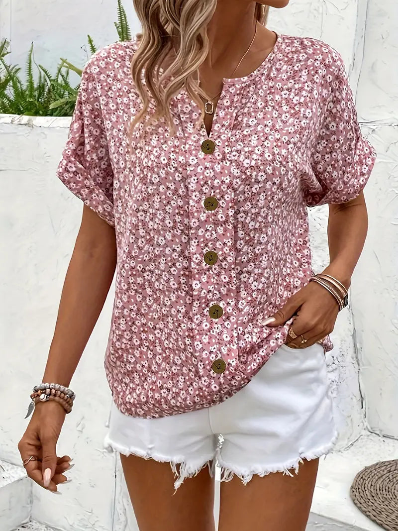 Close-up detail of floral print pattern and button-up front