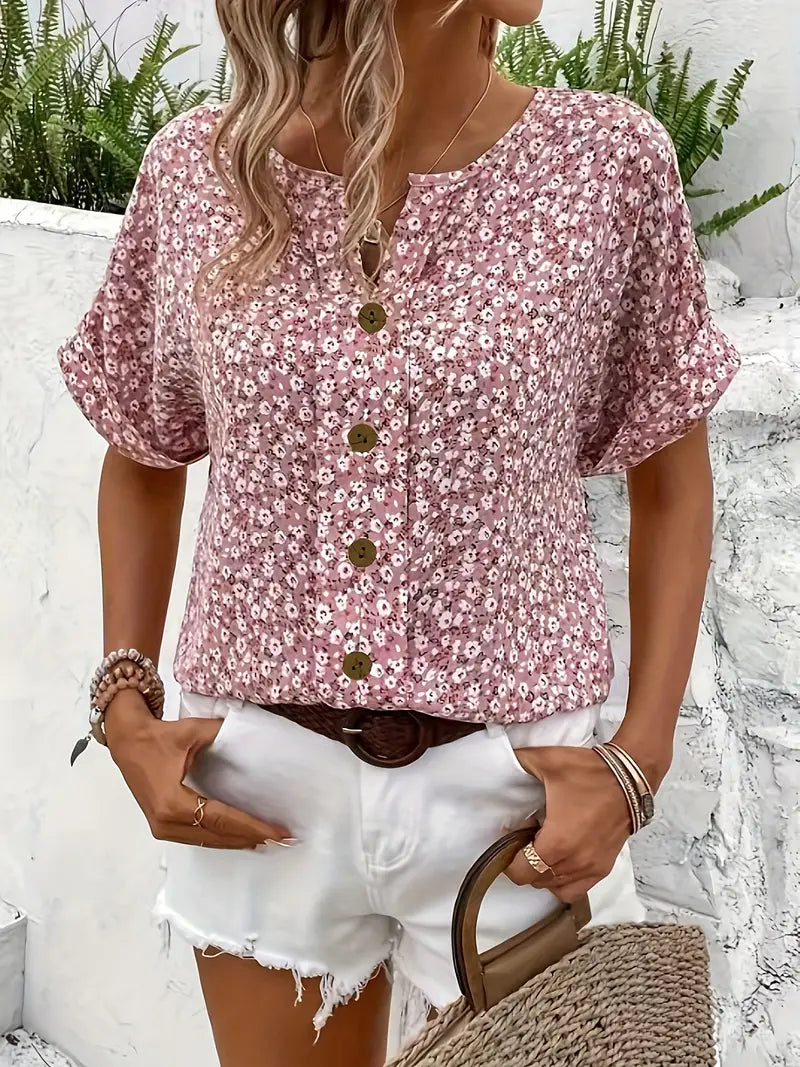 Side angle of pink blouse highlighting v-neckline and drape