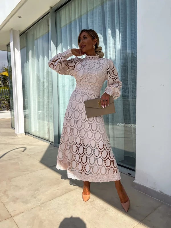 Full-length view of pink lace maxi dress with long sleeves on model
