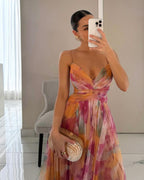 Model wearing floral maxi dress, front-facing pose showing wrap bodice detail