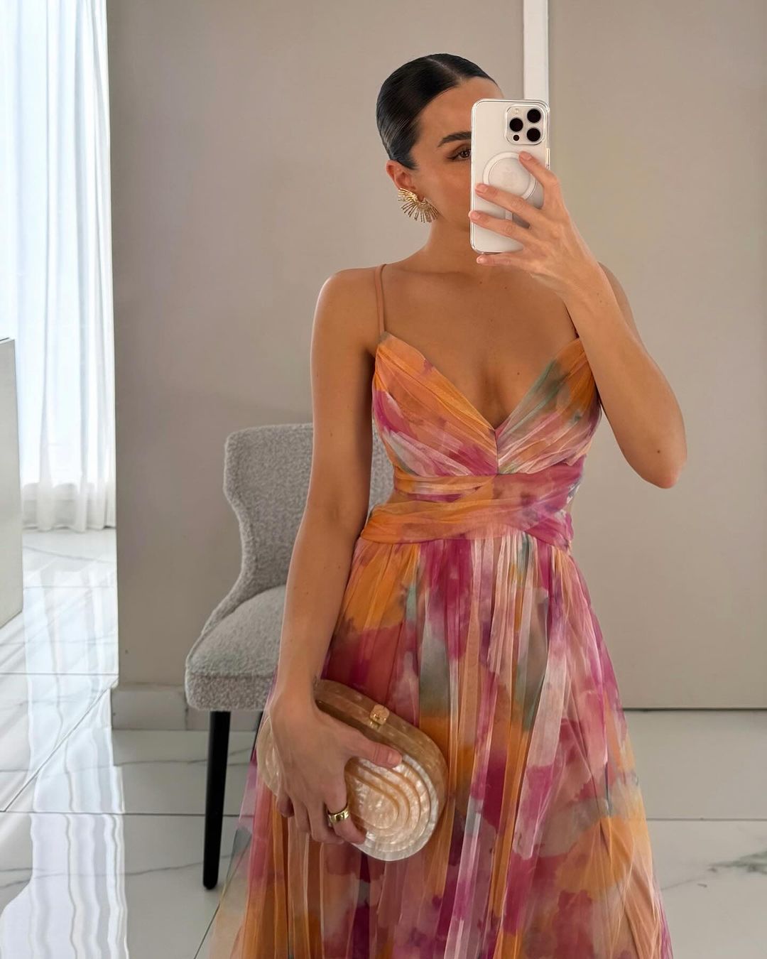 Model wearing floral maxi dress, front-facing pose showing wrap bodice detail