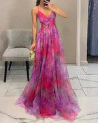 Model from behind wearing floral maxi dress, showing back strap placement