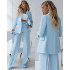 Back view of powder blue suit set showing trouser fit and silhouette