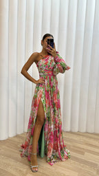Back view of floral maxi dress showing drape and gathered sleeve