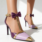 Side profile of pointed toe satin heel with sculpted stiletto