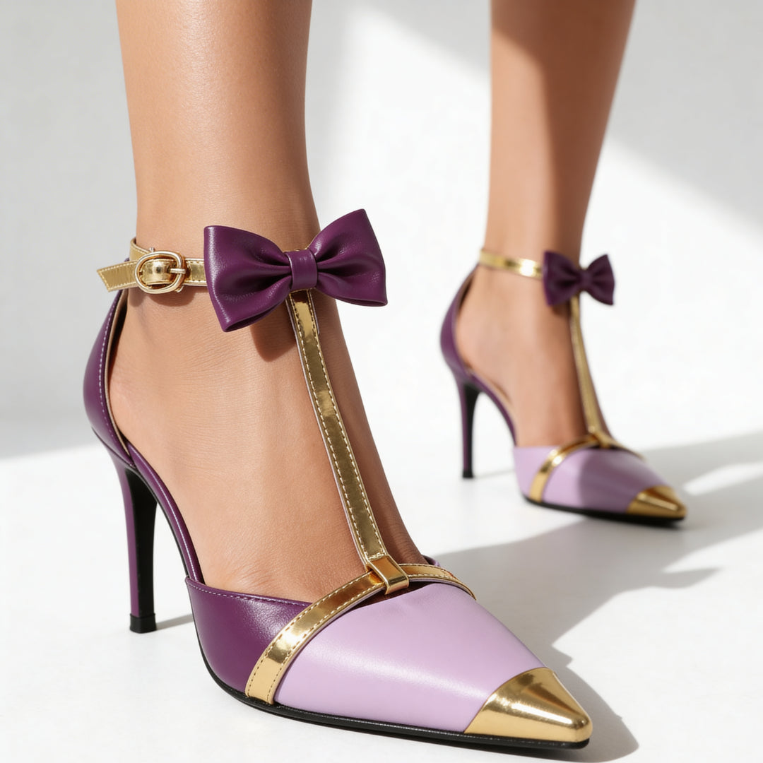 Side profile of pointed toe satin heel with sculpted stiletto