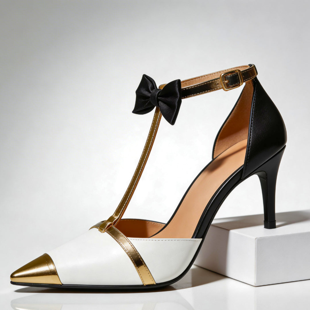 Close-up of metallic gold bow and T-strap on heel