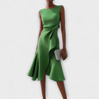 Detail shot of asymmetric waist drape and fabric texture