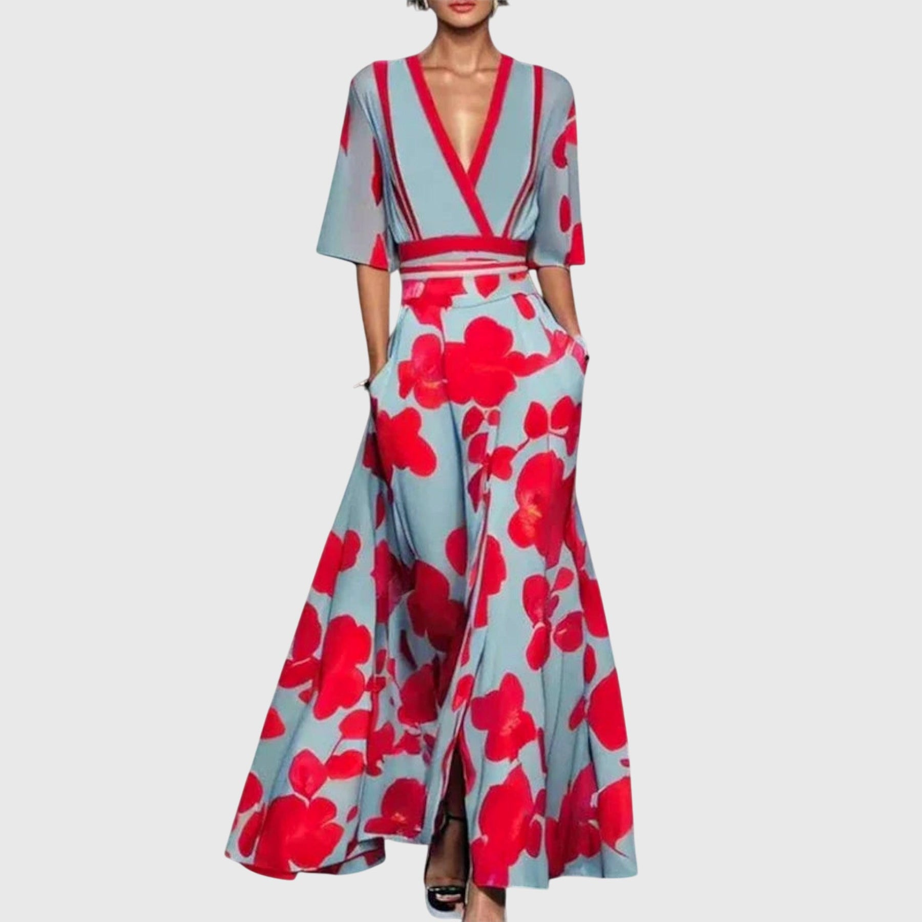 Model wearing red and blue floral maxi dress, front pose