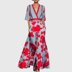 Model wearing floral maxi dress, standing pose showing wrap bodice detail