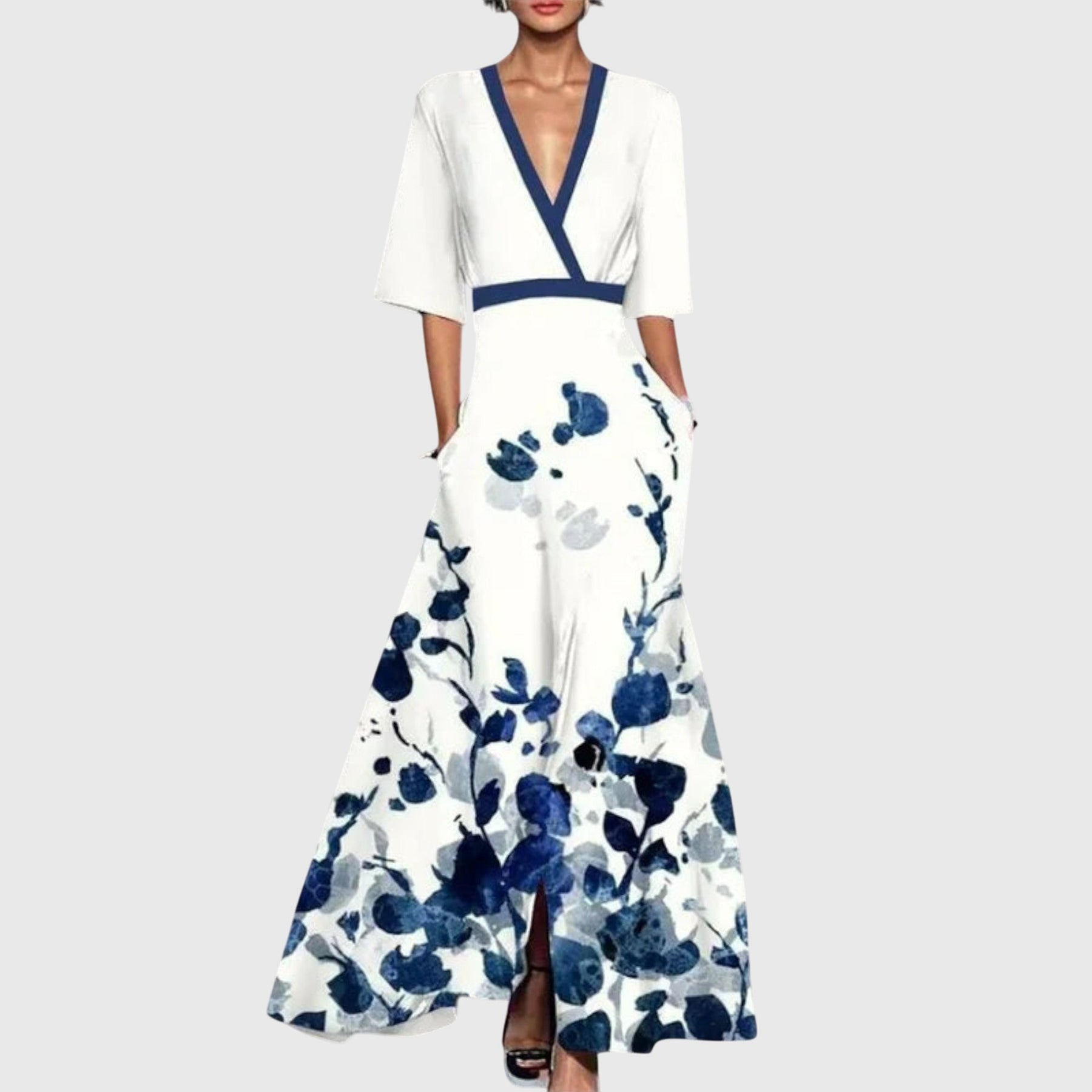 Side profile of model in floral dress, demonstrating silhouette and movement