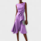 Detail shot of pleated hemline and fluid fabric movement