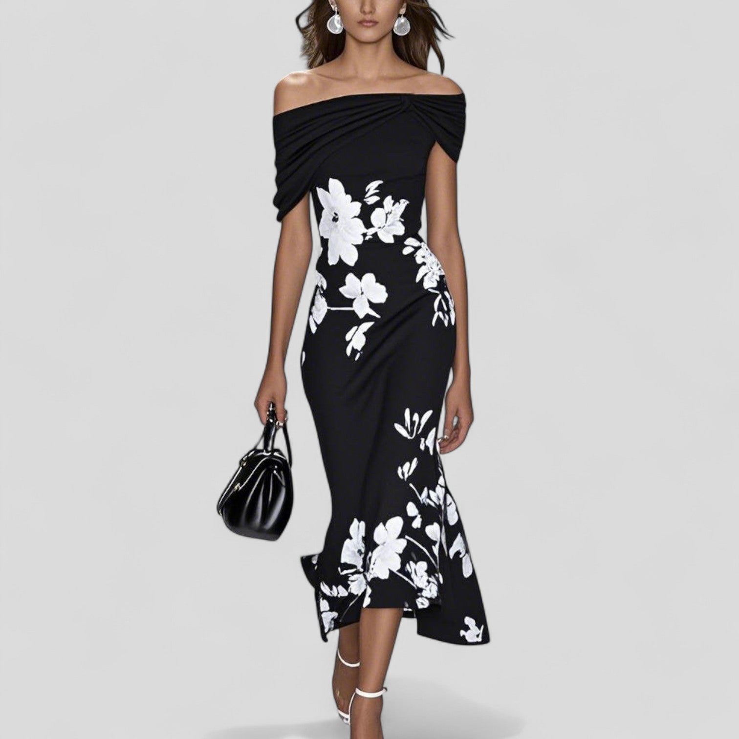 Close-up detail of white floral print and off-shoulder draped neckline
