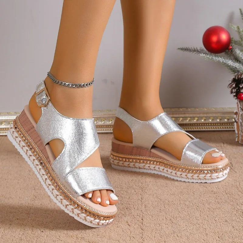 Silver metallic platform sandals with ankle strap, front and side view