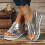Women's silver metallic cut-out wedge platform sandals displayed on white background