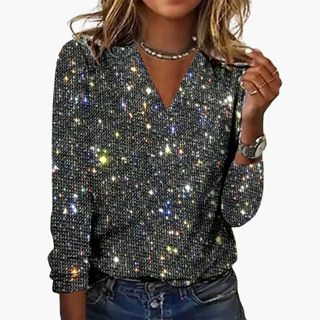 Close-up detail of sequin embellishment and long sleeve cuff