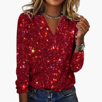 Model wearing sequin V-neck top, front pose showing drape and shimmer