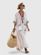 Women's striped maxi dress with V-neck, full-length view on model