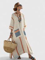 Model in striped dress, back view showing drape and fit
