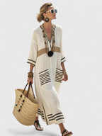 Model wearing striped maxi dress, standing pose front view