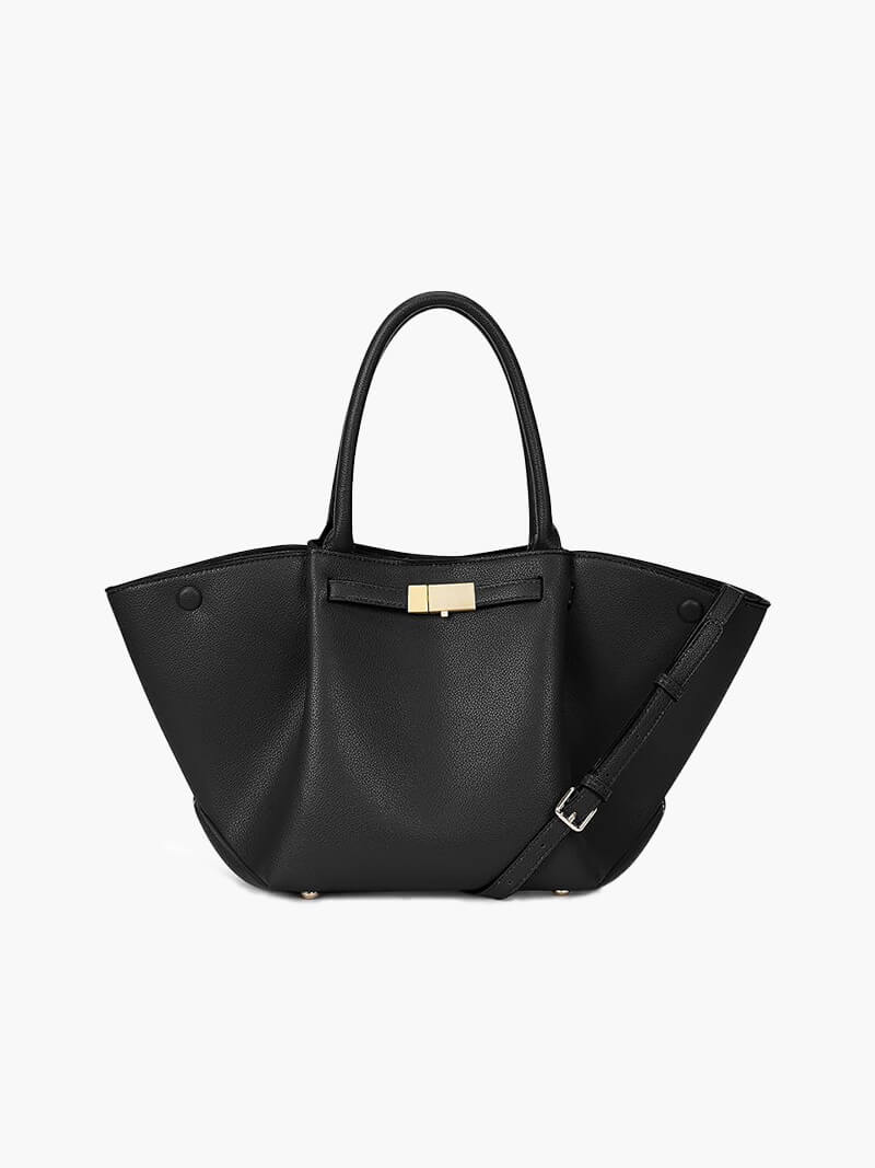 Woman wearing tote bag over shoulder, side angle