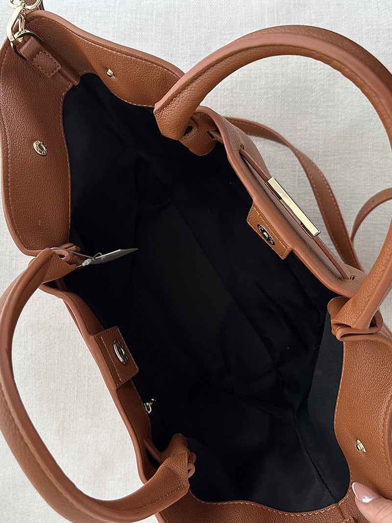 Back view of leather tote with twin handles
