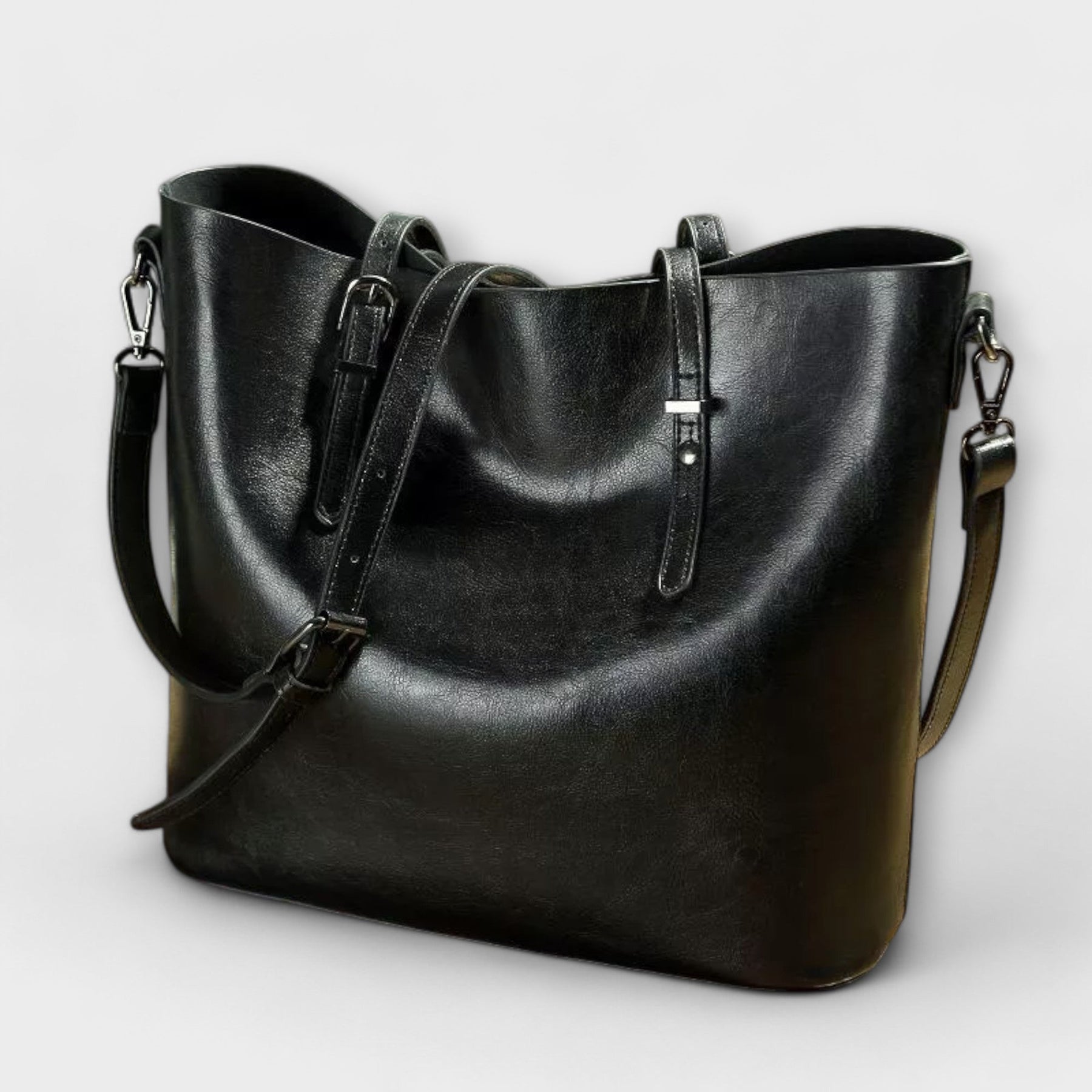Woman carrying tan leather tote crossbody style, walking shot