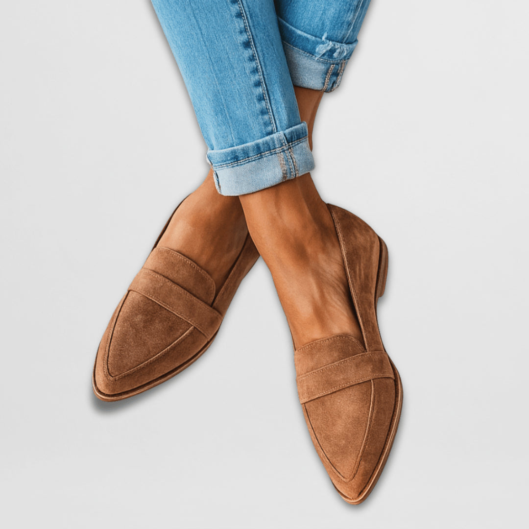 Tan suede loafers displayed front-on view showing classic silhouette and velvety finish