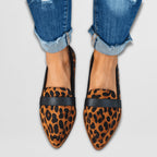 Side profile of loafer shoe highlighting flexible sole and low heel design
