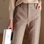 Back pocket detail on herringbone trousers