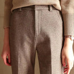 Model walking in wide leg trousers and blazer