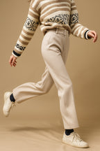 Model in office setting wearing formal styling