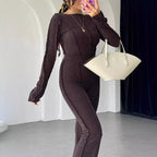 Side view of model in knit set showing cropped silhouette and trouser length