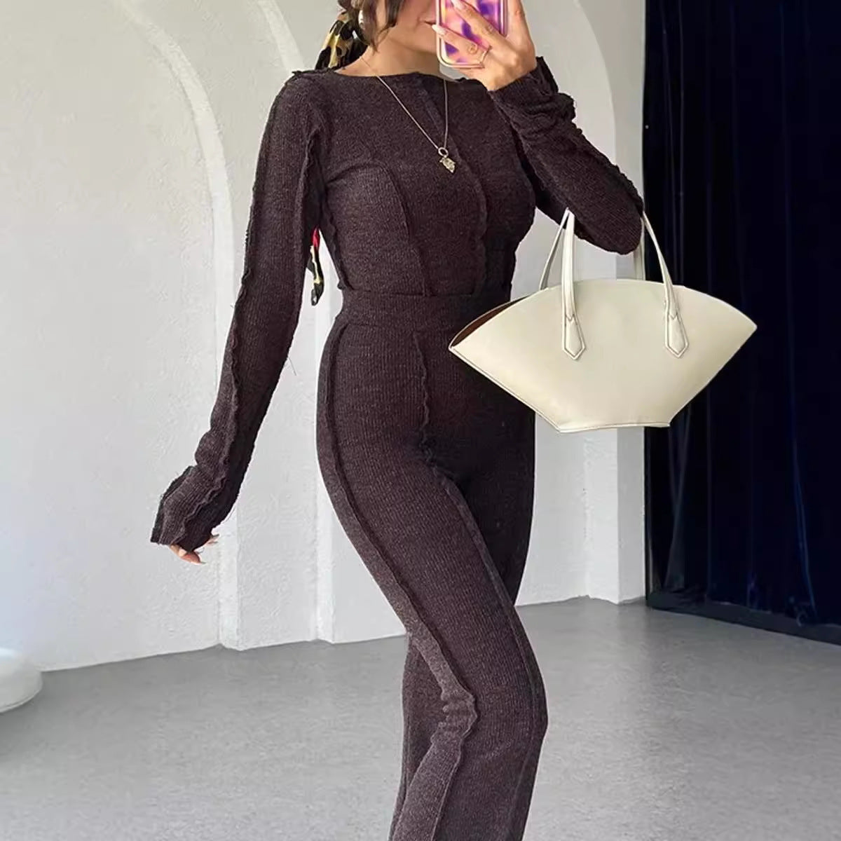 Side view of model in knit set showing cropped silhouette and trouser length
