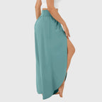 Back view of teal wide leg trousers showing split hem detail