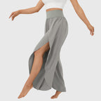Close-up of split hem detail on teal wide leg trousers