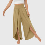 Three-quarter view of teal trousers on model
