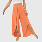 Model walking in teal trousers, showing movement and flow