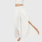 Fabric texture and drape detail on teal wide leg trousers