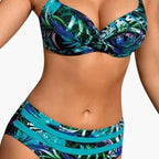 Woman wearing tropical print underwire bikini set with high-waisted bottoms, front view