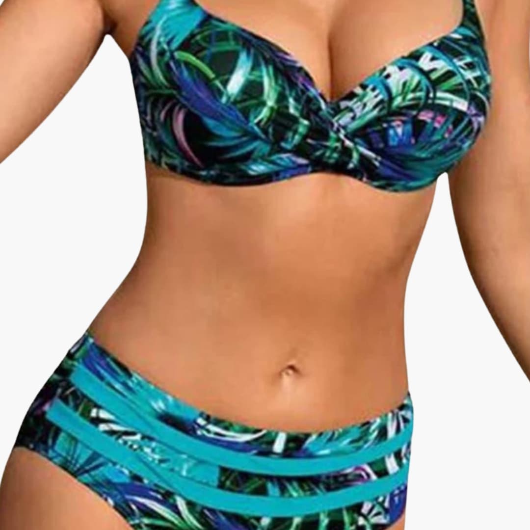 Woman wearing tropical print underwire bikini set with high-waisted bottoms, front view