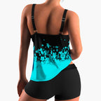 Woman wearing floral tankini swimsuit with square neckline and matching bottoms, front view
