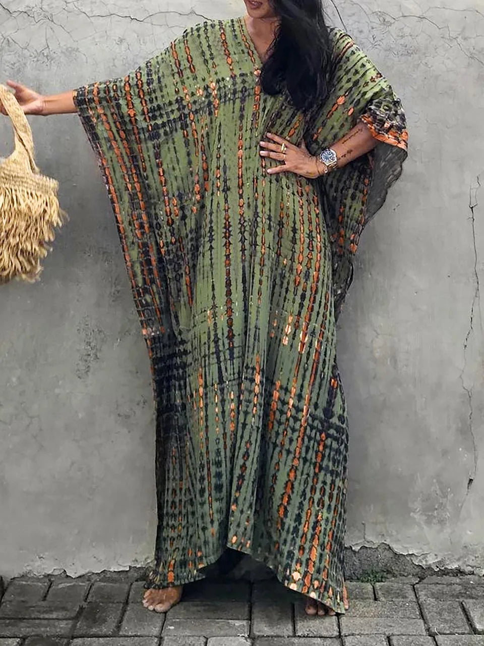 Full-body view of tie dye caftan on model, back angle