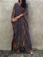 Tie dye caftan hem and length detail on model