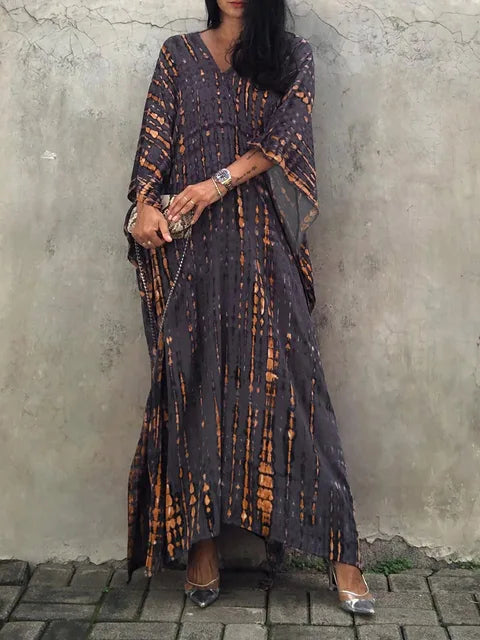 Tie dye caftan hem and length detail on model