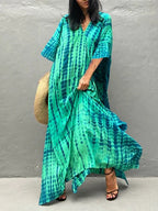 Turquoise tie dye caftan maxi dress on model, front view