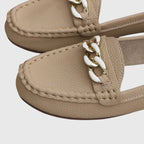 White chain loafers shown from the side