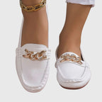 Three-quarter angle view of white chain loafer