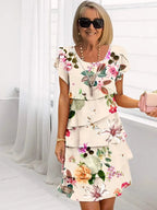 Close-up of pink floral print and ruffle texture on dress