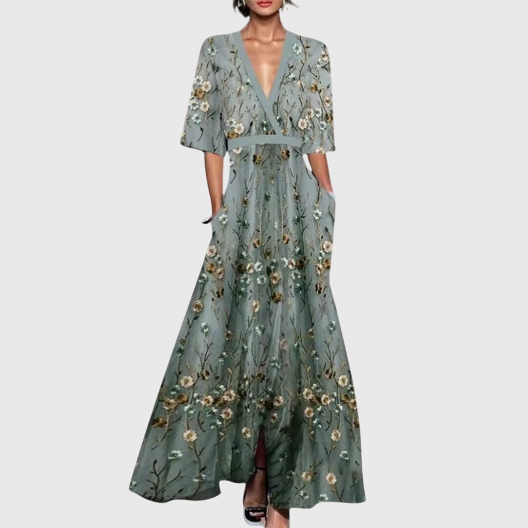 Model wearing floral maxi dress, side profile showing A-line silhouette